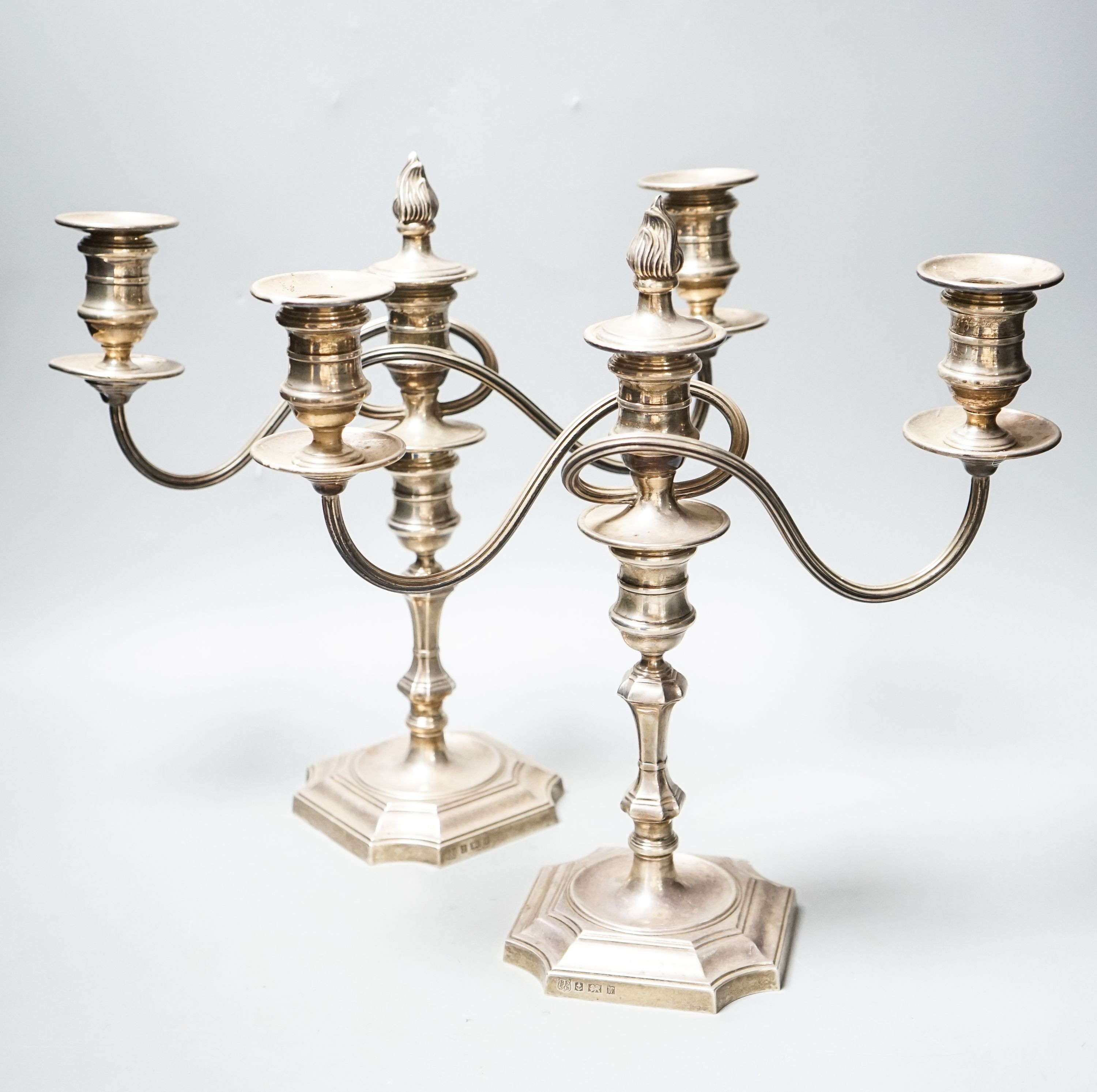 A pair of modern 1970's silver two branch, three light candelabra, height 30.4cm, weighted.